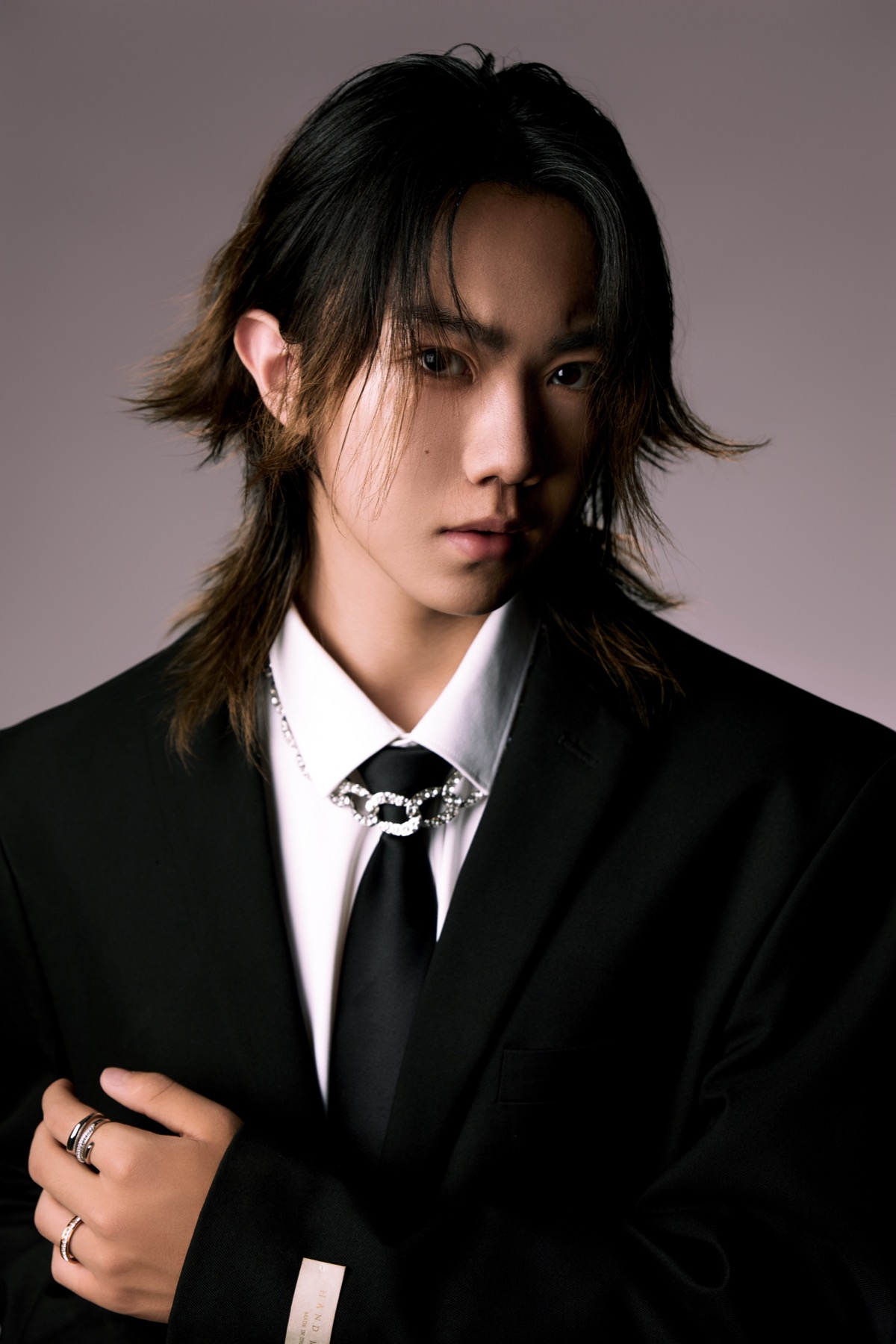 Portrait of Wayne Wen in a black suit